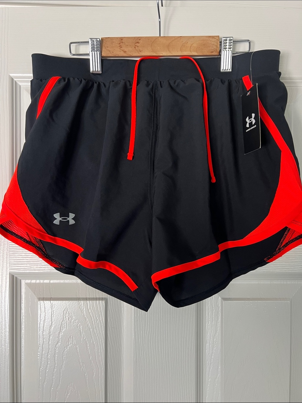 Under Armour Black Shorts with Bright Red trim - comes in Med. And small